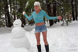 Lucky snowman gets to feel this blonde's big boobs press against him