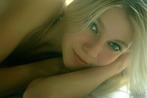 Angelic blondie with long legs is prepared t o show it all on a bed