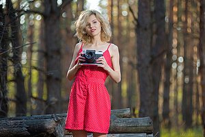 Red dress wavy-haired blonde flashing her pussy in the woods