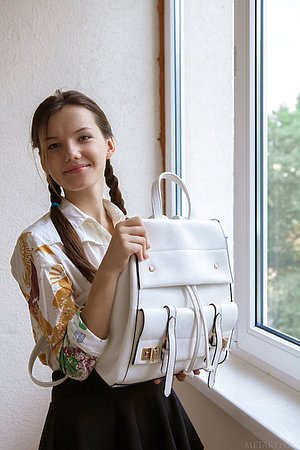 Braided teen in a white shirt finally gets naked and shows her ass