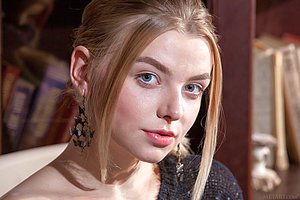 White panties blond-haired beauty reading and seducing the viewer