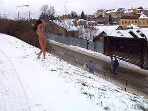 Santa hat teen showing her perfect naked body on the snowy streets
