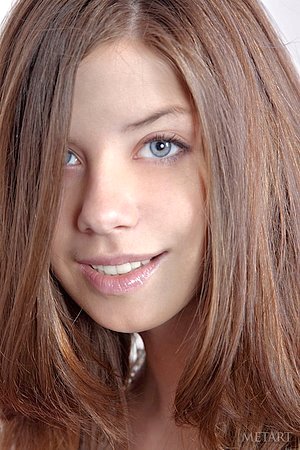 Busty young girl with a cute smile will seduce you in seconds