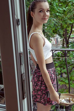 Tiny white crop top brunette gets naked after taking off her skirt