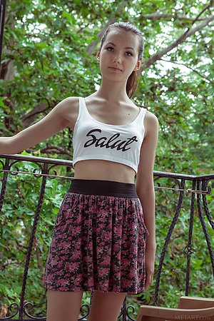 Tiny white crop top brunette gets naked after taking off her skirt