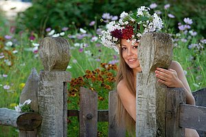 Flower-loving brunette showing off her trimmed, enticing pussy outdoors