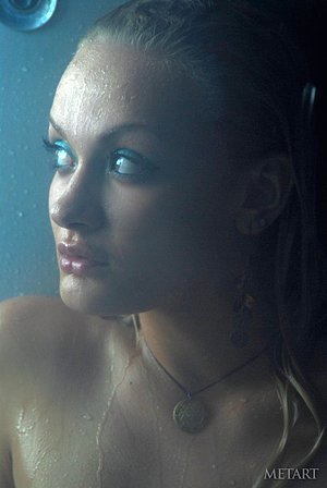 Naturally curvy blonde shows off her nude body in the shower