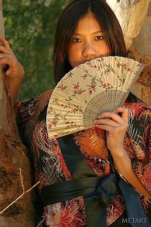 Asian beauty in a traditional outfit shows her insane flexiblity