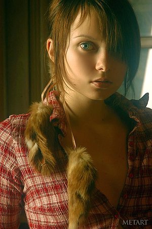 Young beauty with a flat belly posing in a cabin, looking really nice