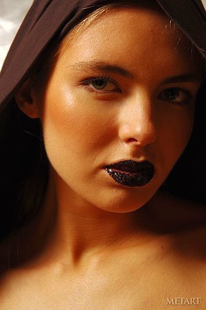 Dark-haired babe with edgy Asian body art posing naked for the cam